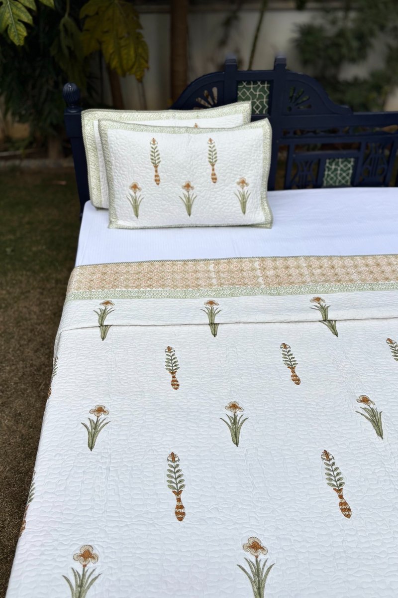 Jaipur hand block print quilted bedcover with botanical floral pattern and soft green edging, breathable cotton bedspread