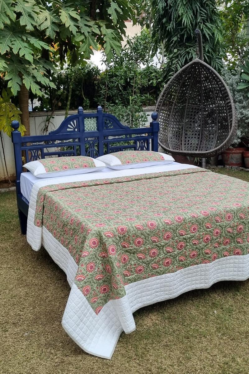 Hand block printed green floral cotton quilted bedcover with pillows with ivory border