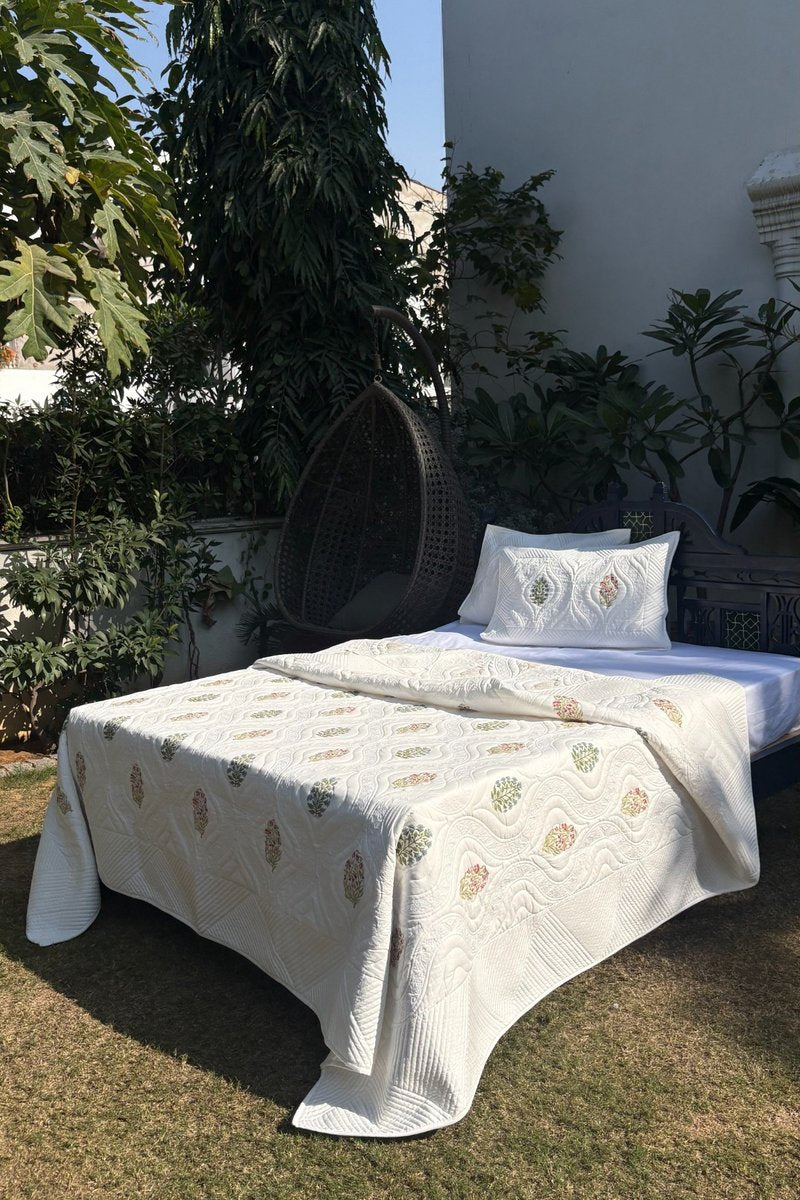 Jaipur hand block inspired floral quilt in ivory with multicolour buti motif