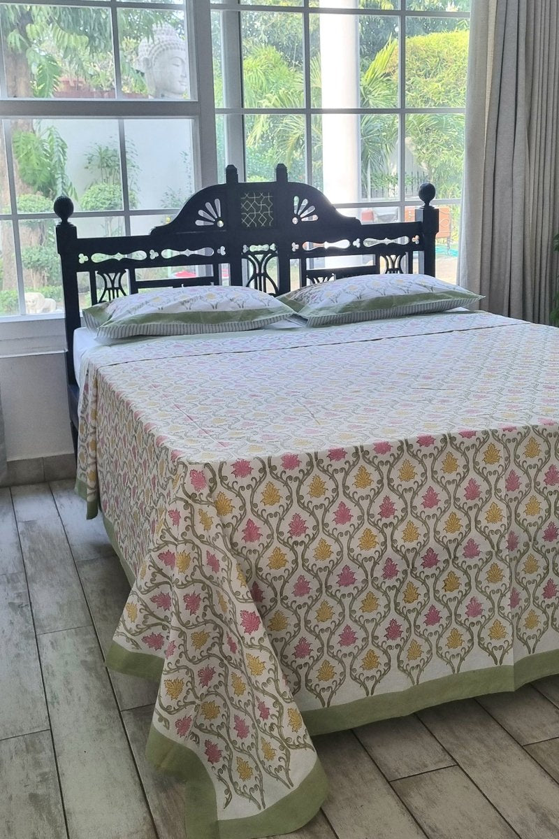 King size cotton bedsheet with traditional Indian block print in pink and yellow floral pattern