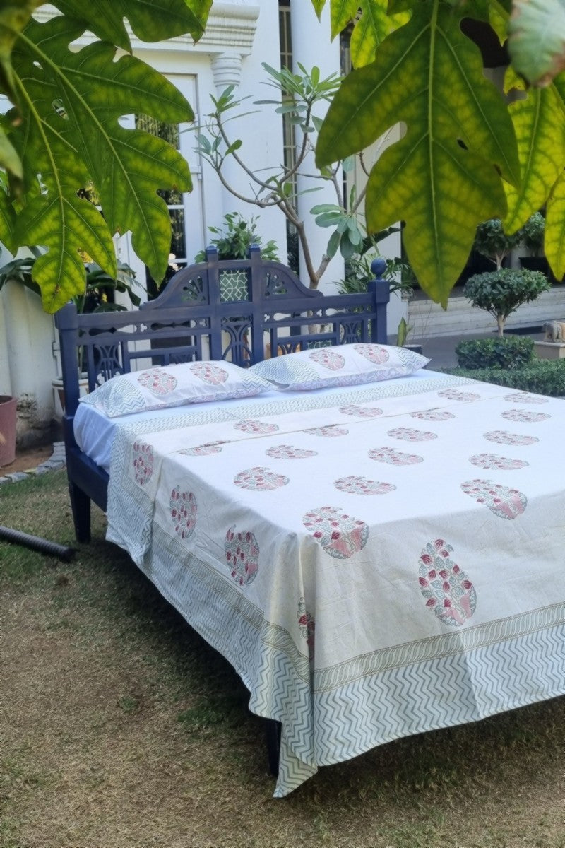 Indian hand block printed bedding set in muted pink and green tones with classic buta pattern