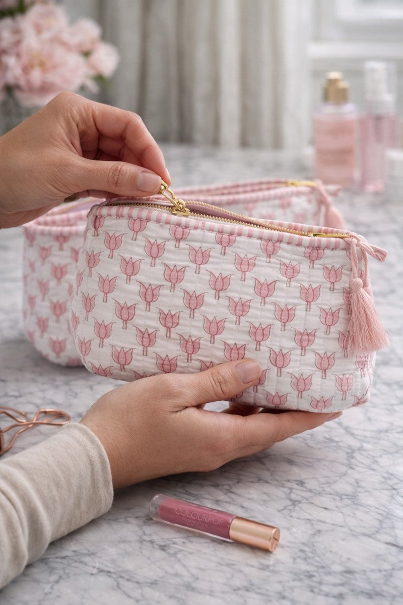Lotus block print quilted vanity kit set with waterproof lining, pink floral makeup pouches displayed on marble countertop