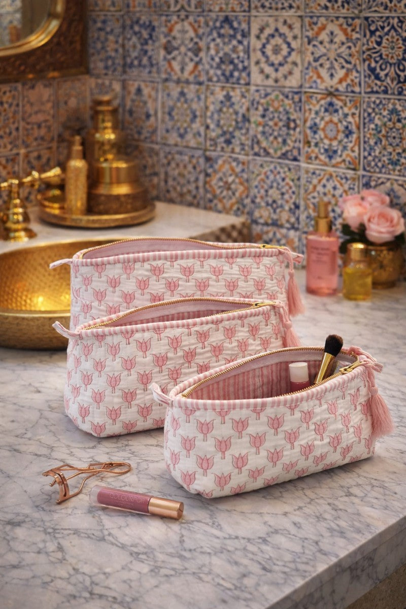 Pink lotus block print vanity pouch with waterproof interior and gold zipper, soft quilted cotton makeup bag