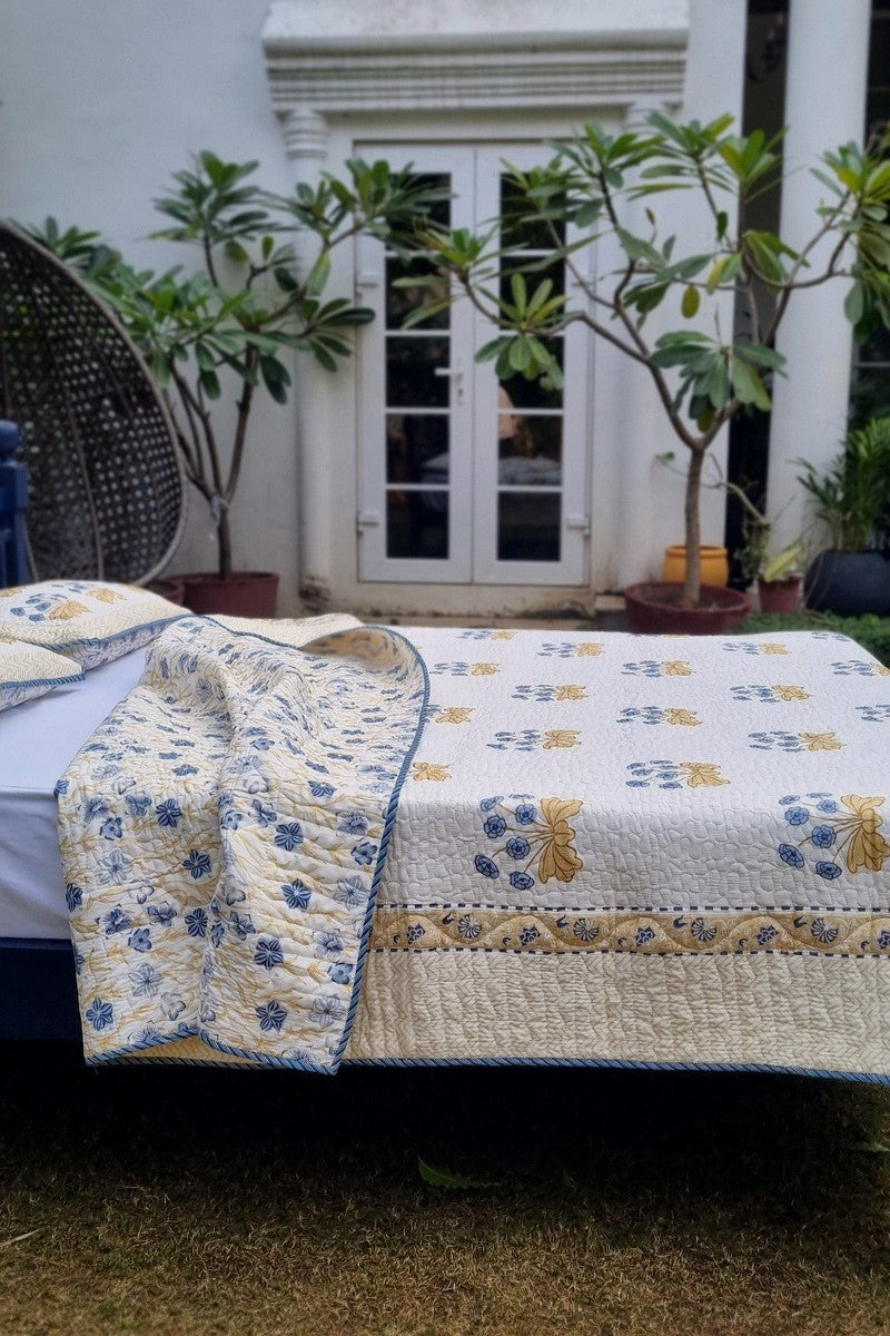 Luxury cotton bedspread with blue floral buta and mustard leaf motifs