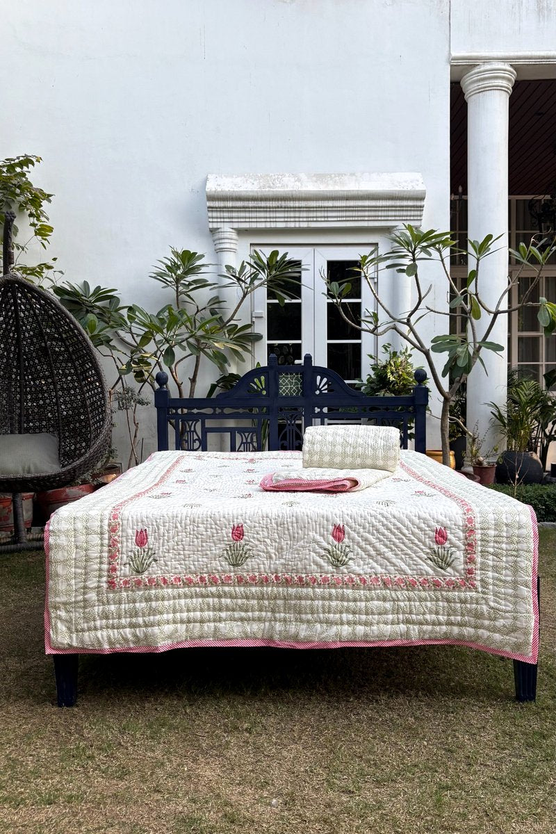 Hand block printed pink tulip quilt on ivory cotton with Mughal inspired floral border