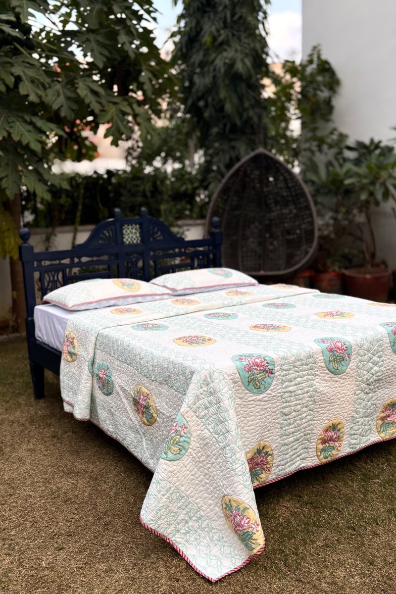Pastel aqua hand block printed cotton quilted bedcover with floral medallion motifs and striped pattern, luxury Jaipur bedding set