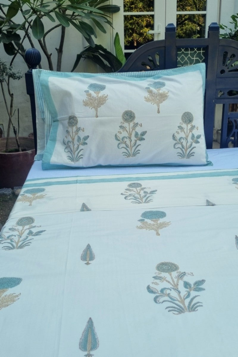 Premium cotton bedding set featuring traditional Indian block print in soft aqua and beige tones