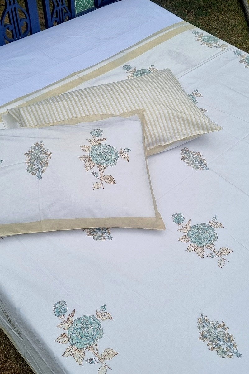 Aqua rose motif hand block printed double bedsheet with soft beige border and striped pillow backing