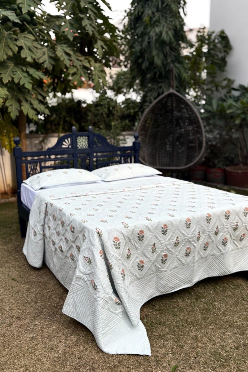 White hand block printed cotton quilt with delicate floral motif, handcrafted Indian bedding set