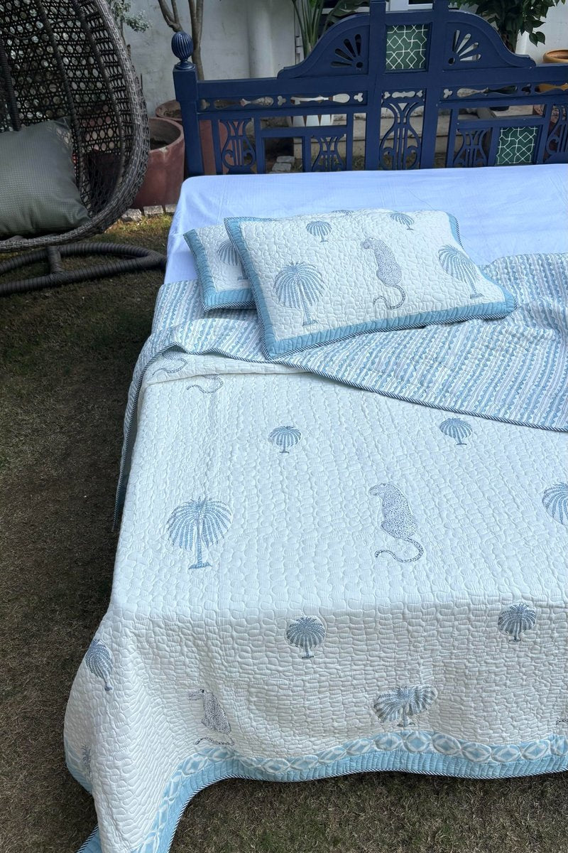 Luxury hand block print cotton quilted bedcover set with palm tree pattern and blue border detailing