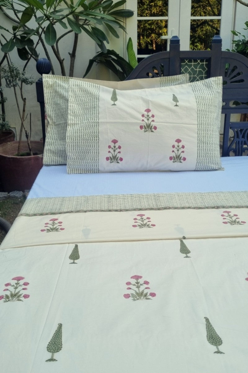 Jaipur block print double bedsheet with small pink flower buta design and striped green border detail