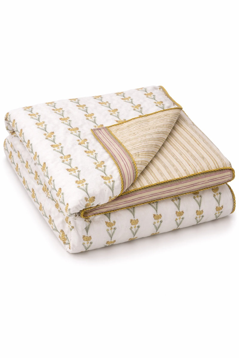 Folded fabric with brown floral pattern on a dohar