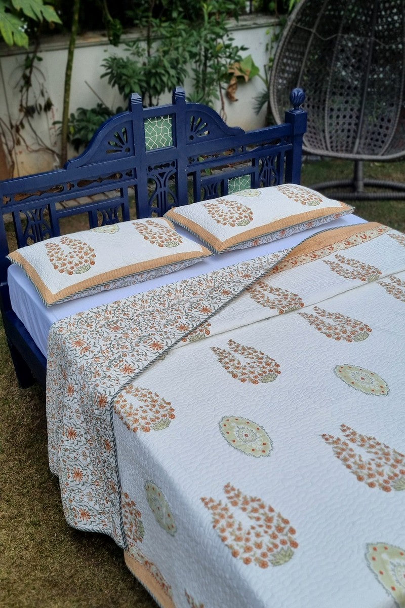 Ivory handblock summer bedcover with floral vine reverse and peach edging