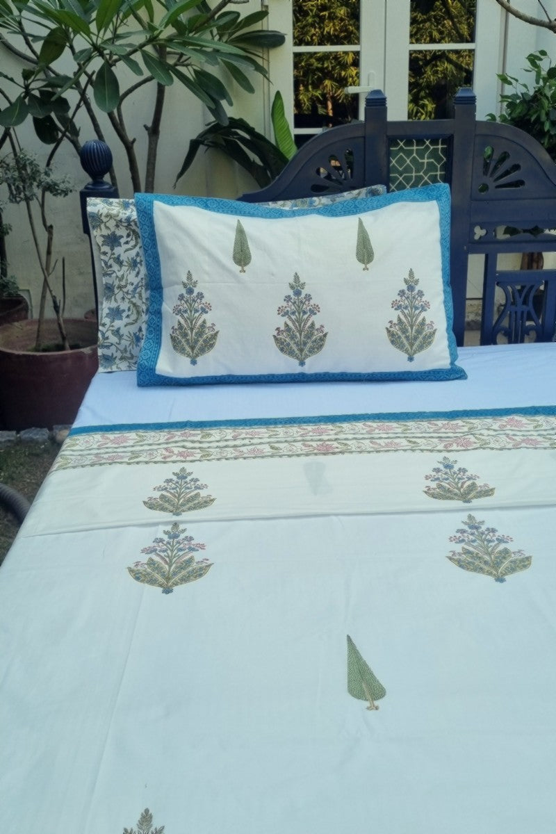 Cotton pillow covers with traditional Indian block print in green and blue with detailed border trim