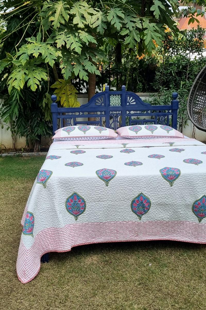 Reversible Jaipur style block print quilted bedcover with pillows in striped pink border