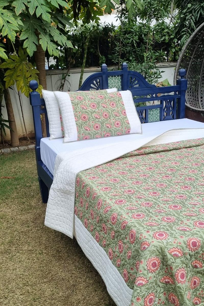 Jaipur block print quilted bedcover with pilllows in sage green with pink floral pattern