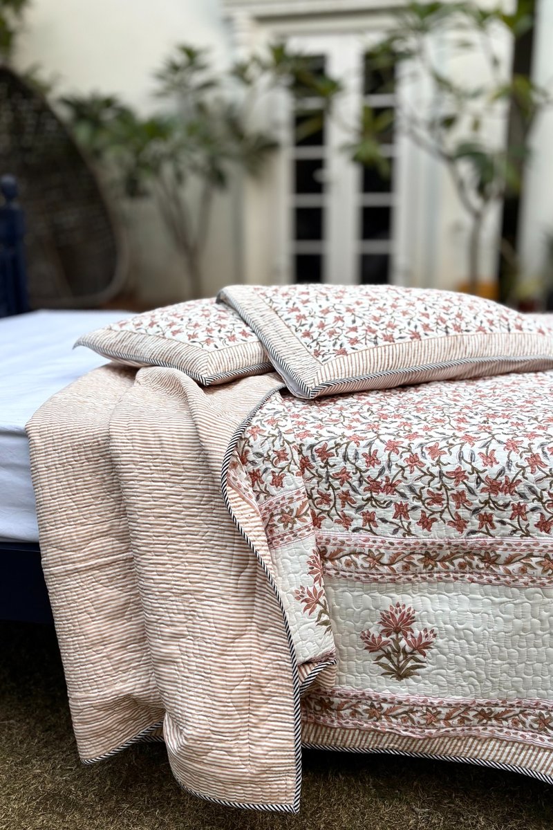 Premium cotton quilted bedcover with rust botanical print and intricate quilting pattern, Indian block print bedspread
