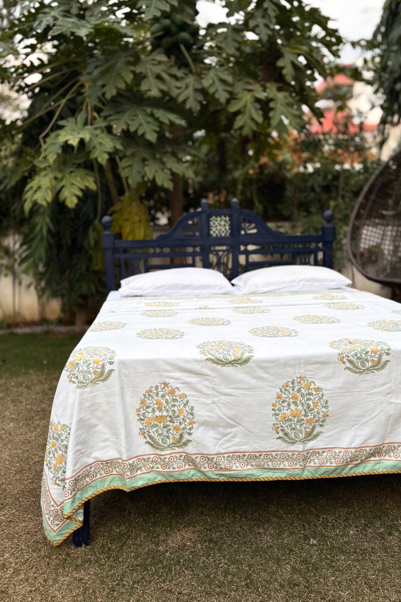 Hand block printed cotton dohar with yellow floral buta on white base and sage green border, luxury Jaipur bedding set