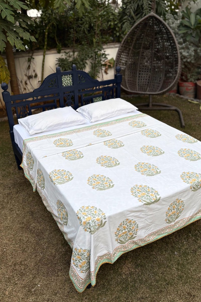 cotton dohar with mustard yellow floral motifs and traditional border, breathable summer quilt India