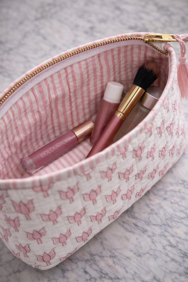 Hand block print lotus vanity pouches in pink, quilted cotton makeup organizers with waterproof lining for travel