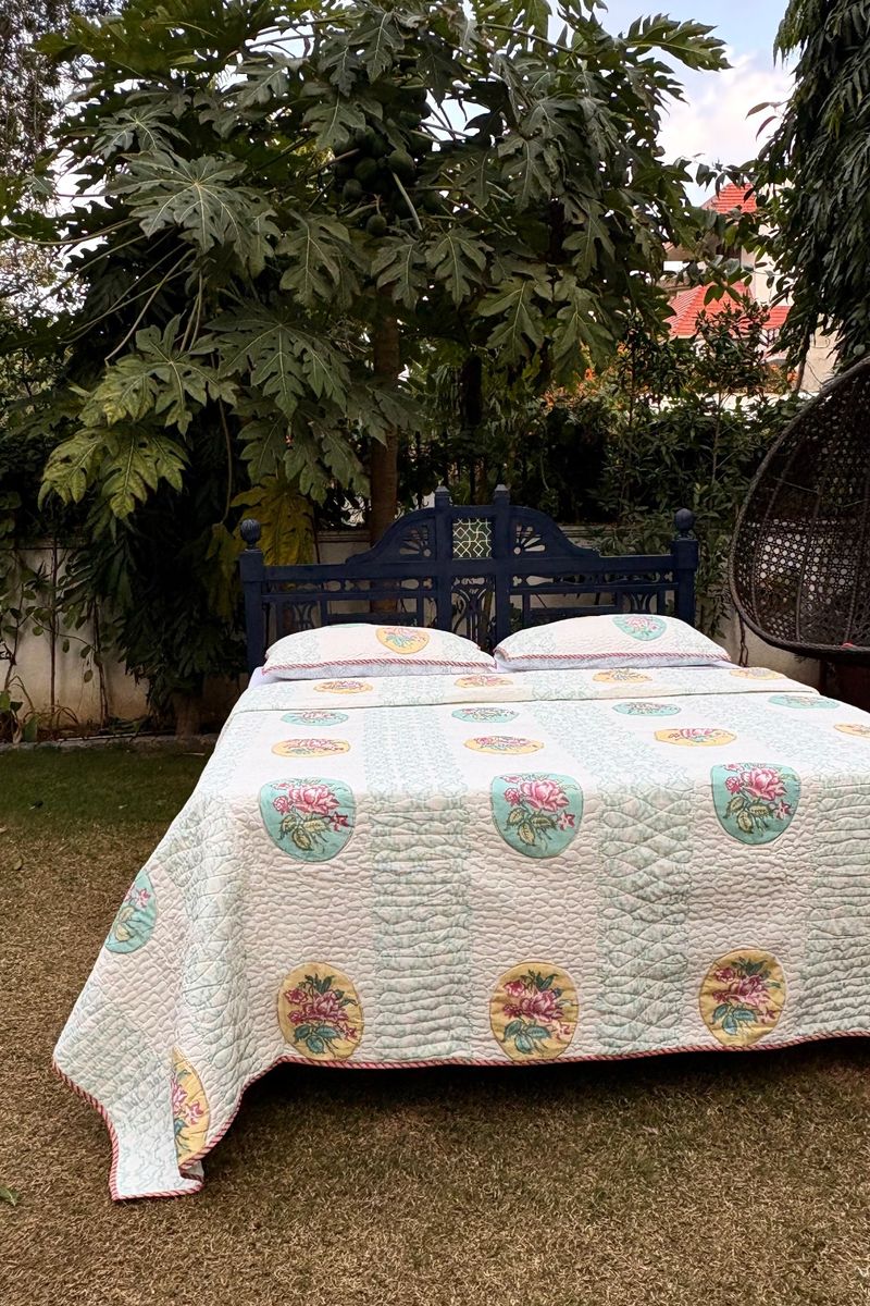 Luxury pastel aqua and pink floral hand block print quilted bedcover set with matching shams, breathable cotton bedding