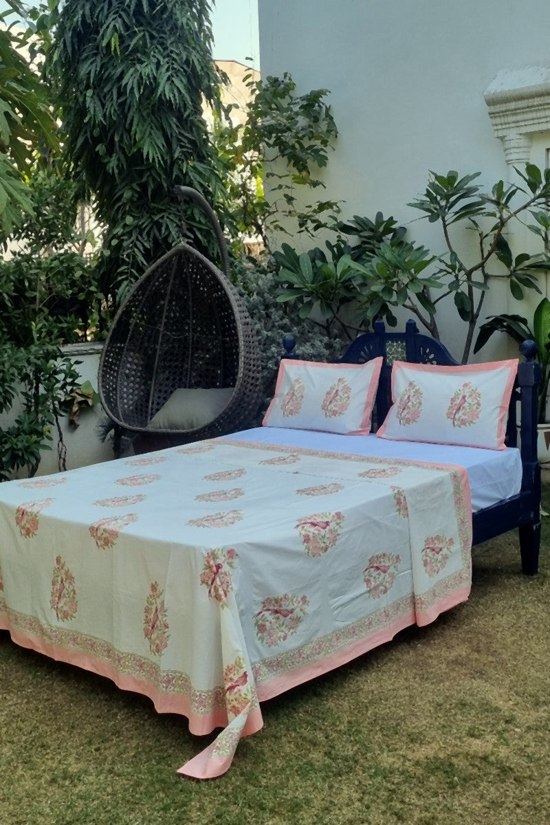 Matching floral printed cotton pillow cover with pink flower vine design on white base, handcrafted bedding set