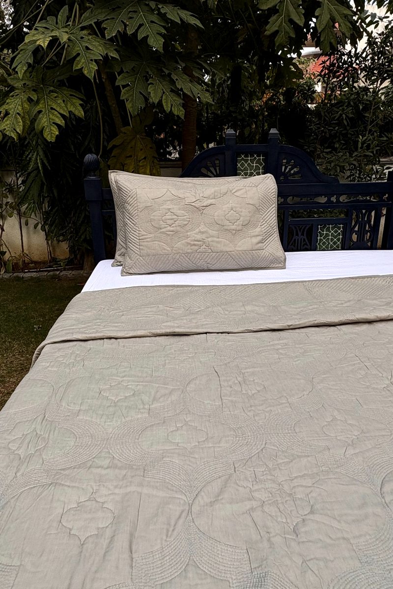 Soft oatmeal quilted pillow cover with tonal stitching on premium cotton fabric