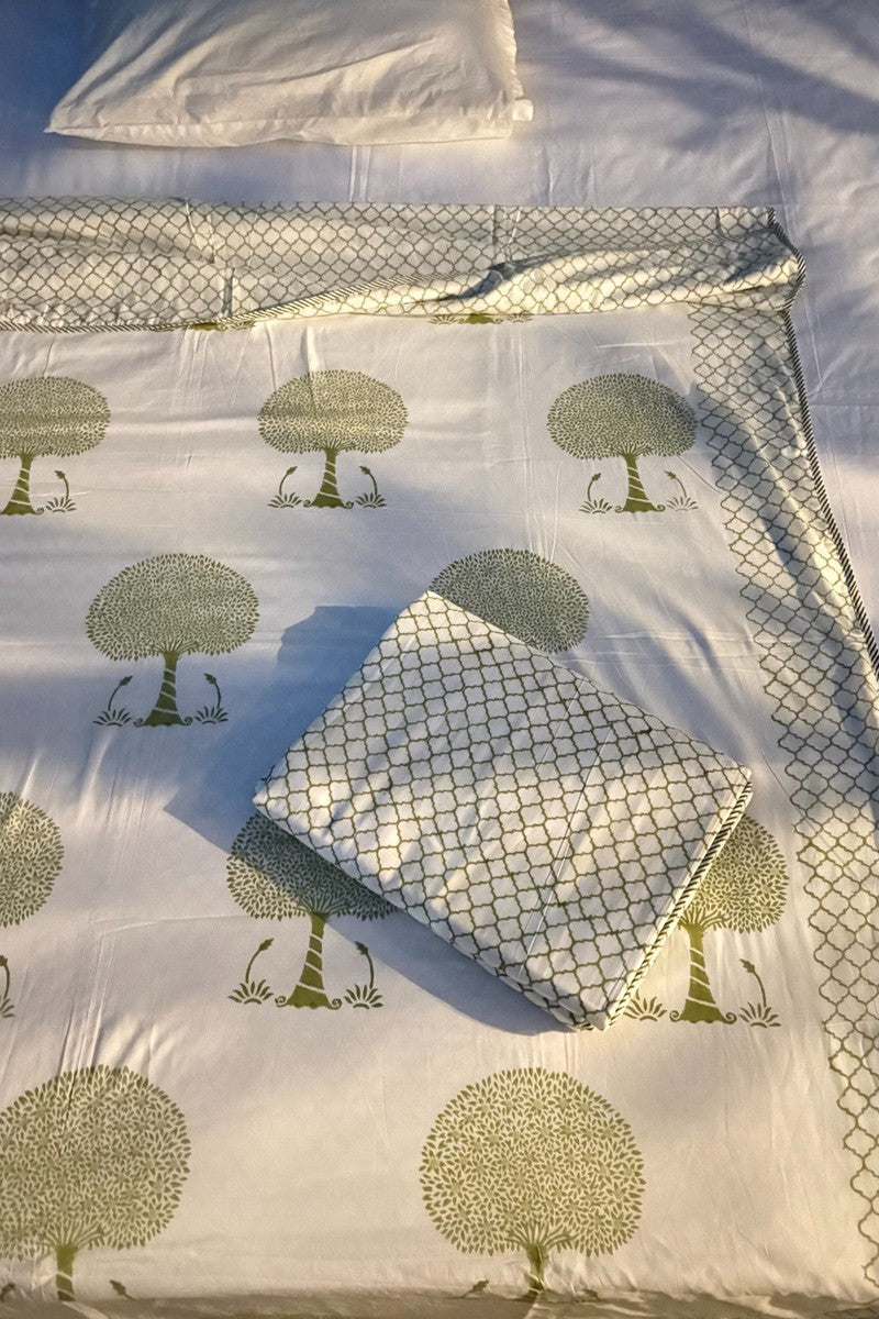White cotton dohar with green tree block print and coordinated geometric print pillow cover – handcrafted Jaipur bedding