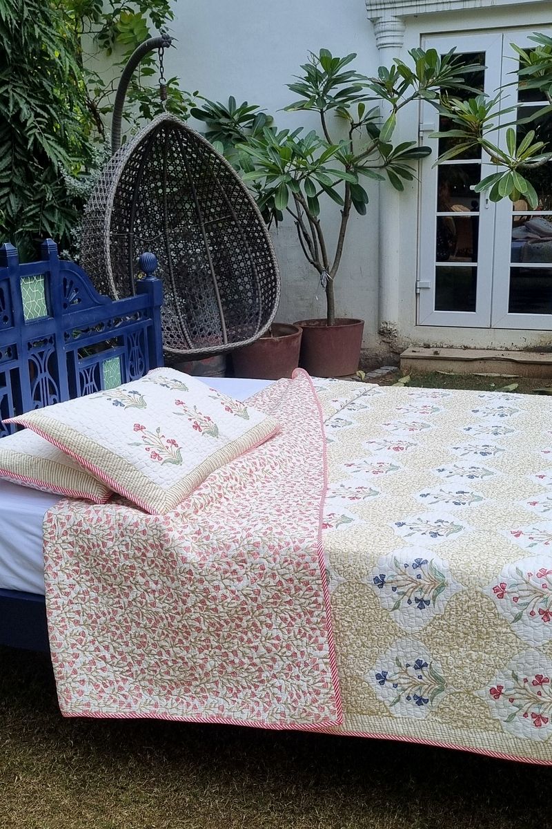 Premium handcrafted cotton bedcover with delicate pink and blue floral buti print